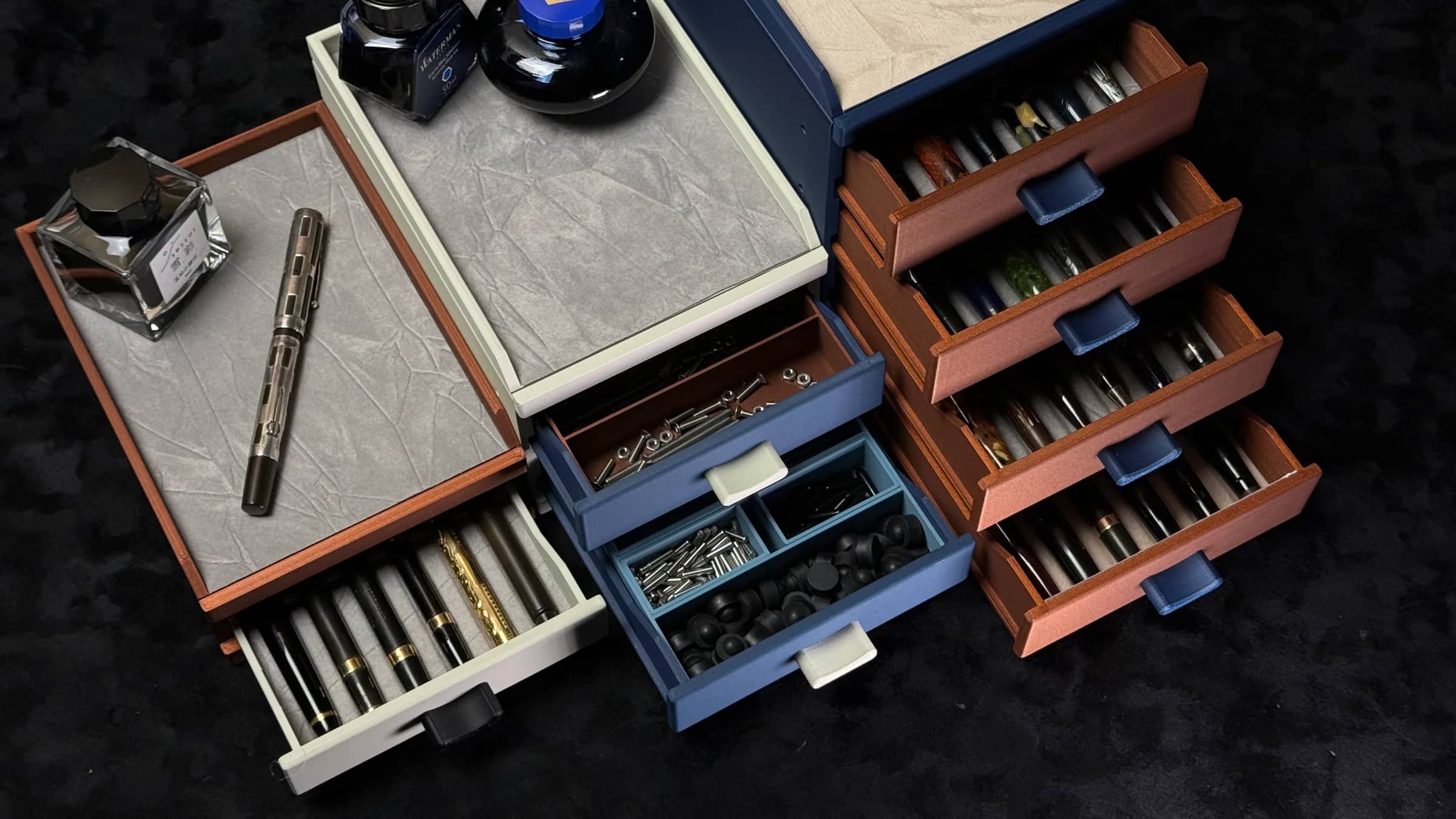 Open Cornerstone modular pen cabinets arranged with fountain pens and ink bottles