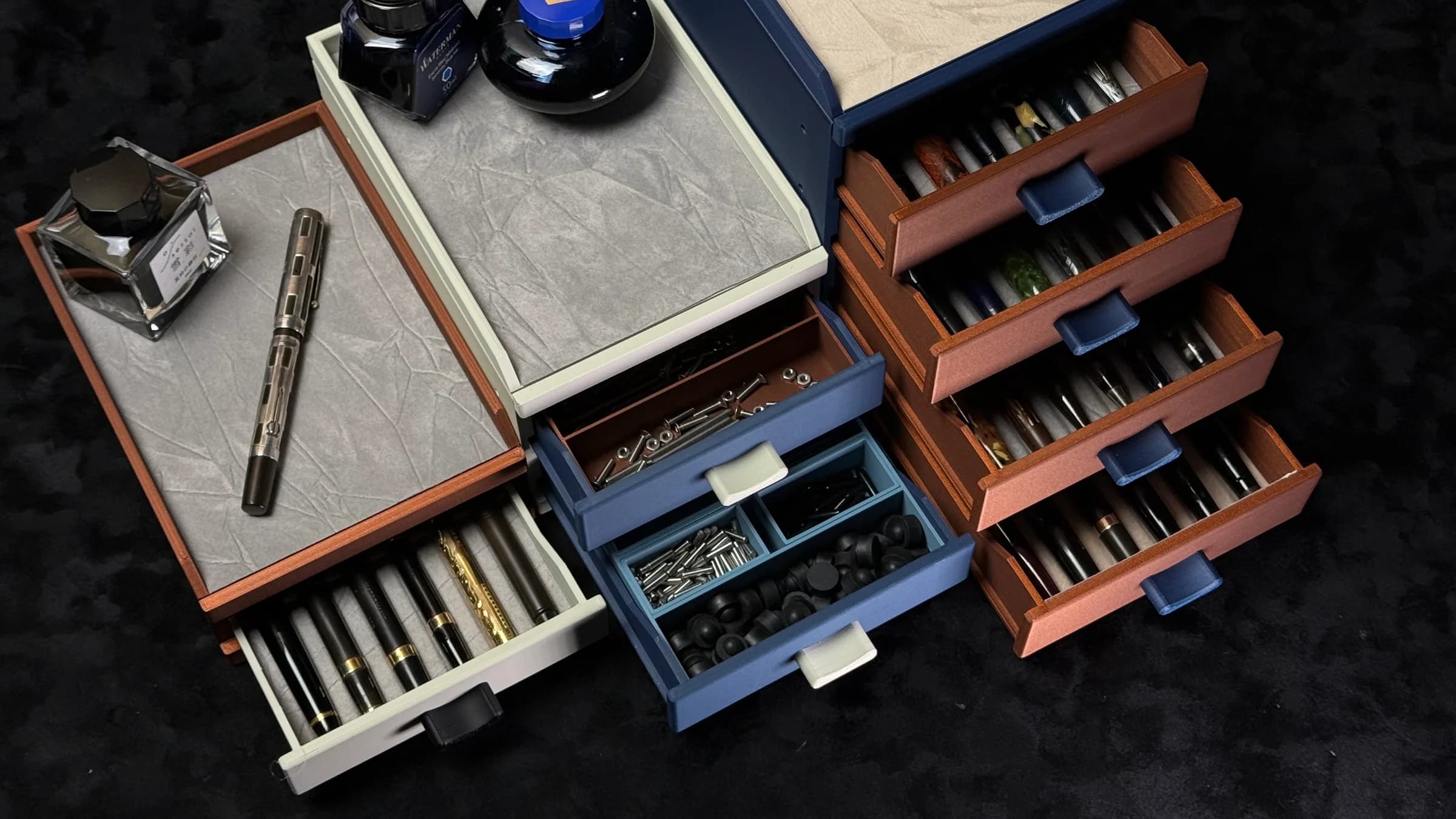 Open Cornerstone modular pen cabinets arranged with fountain pens and ink bottles